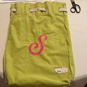 Green Drawstring Back Pack with Pink Letter S Embroidery and 17x14.5 backpack